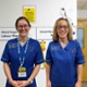 Image shows two midwives in a hospital corridor