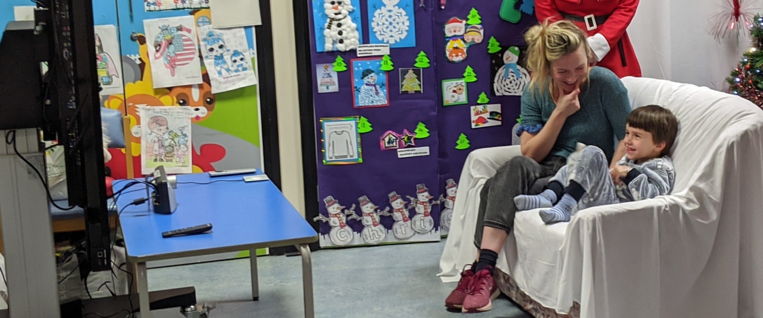 Yanni and mum Pearl speak to Santa using a webcam and television in Ward M