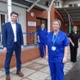 Image shows a group of staff outside a hospital