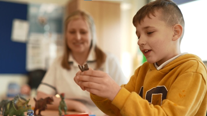 A boy with addiitonal learning needs and his therapist