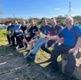 Image shows a group of men having a cup of tea