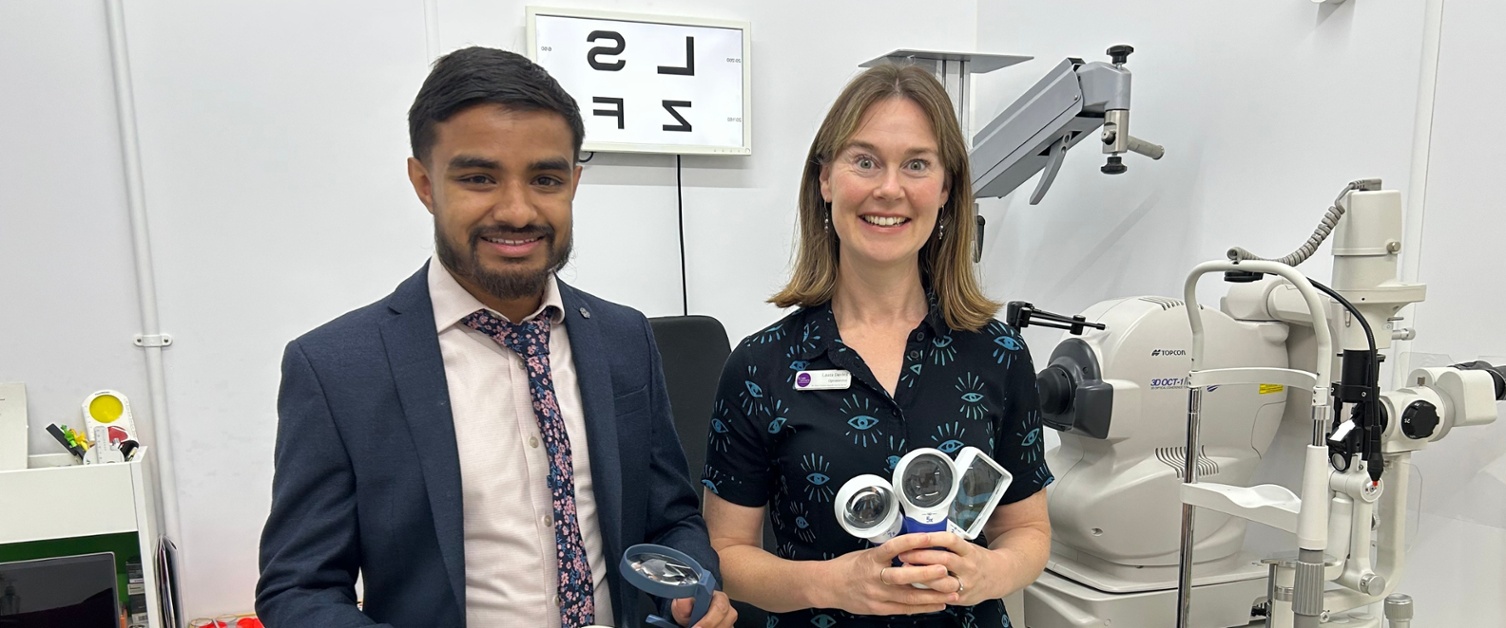 Mohammed and Laura holding visual aids