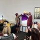 Image shows two people unveiling a plaque