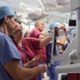 Medical staff examining some new robotic equipment