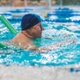 A man swimming in a pool