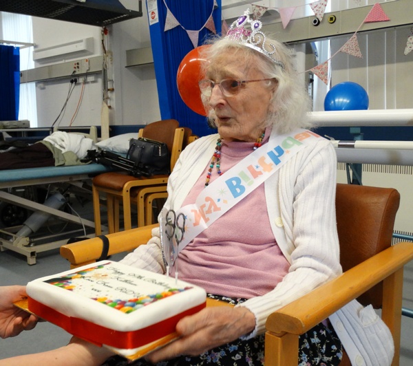 Kathleen Davies, 99, is presented with her birthday cake