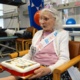 Kathleen Davies, 99, is presented with her birthday cake
