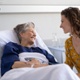 A picture of a hospital visitor with a patient