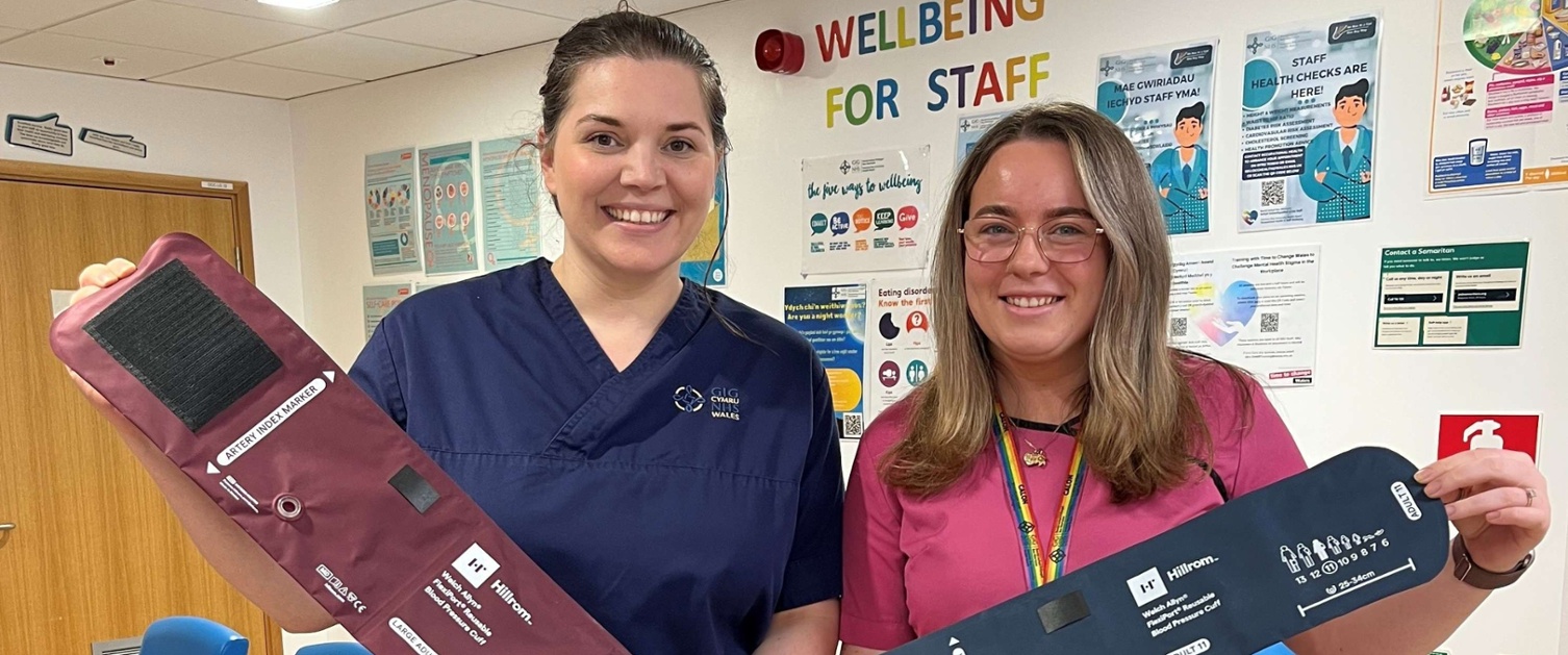 Image shows two women holding blood pressure cuffs