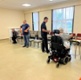 Thumbnail: Image shows patients using dumbbells in a rehabilitation session.