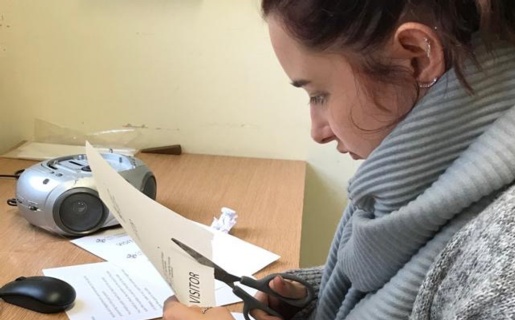 Project SEARCH intern creates name badges in the pathology lab