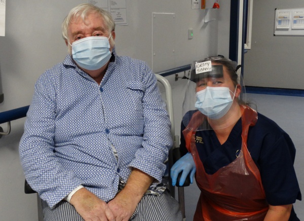 Image shows patient Danny Egan in a wheelchair next to Sister Kirsty Hopkins