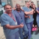 Image shows clinicians wearing scrubs in a hospital catheterisation lab.