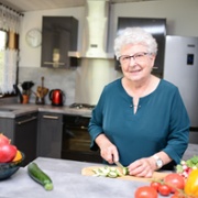 a picture of a woman preparing a meal