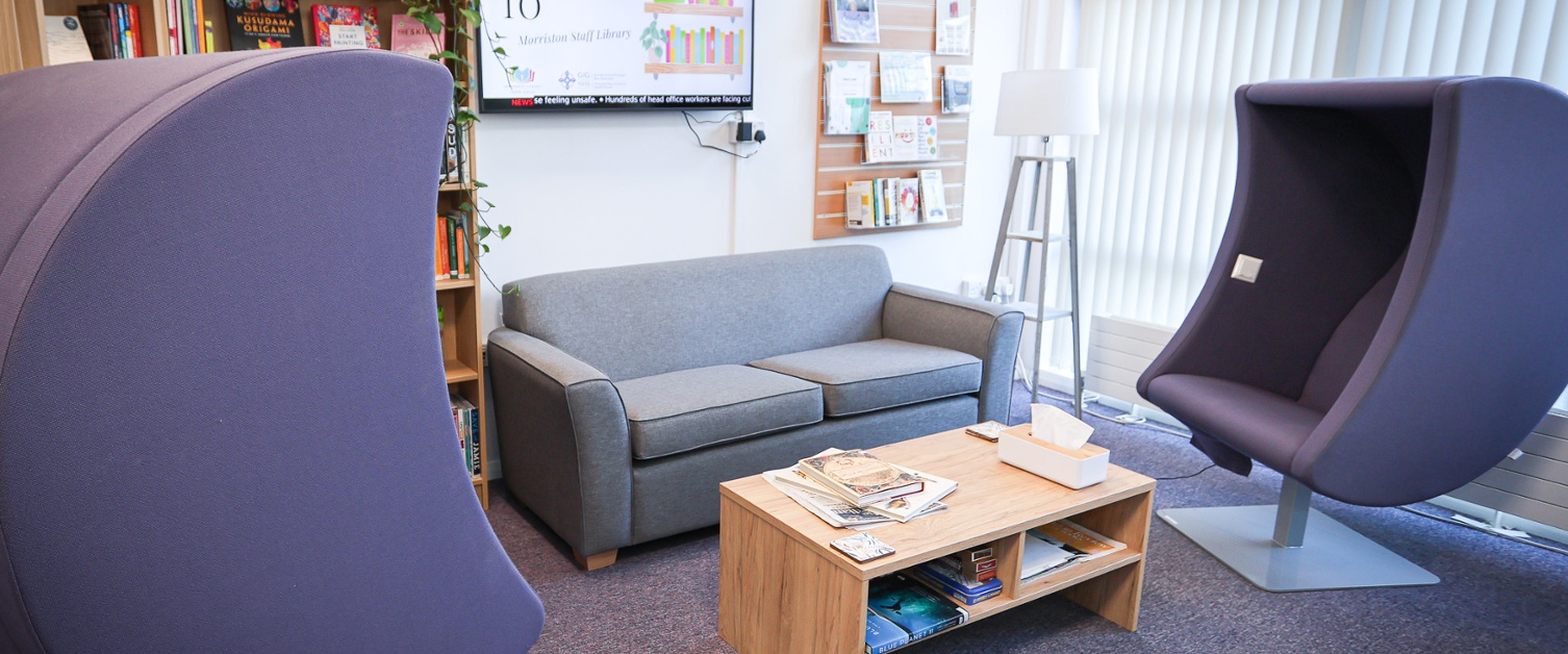 A seating area with sofa and coffee table