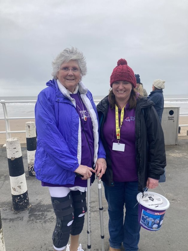 Two women stood on a promenade