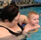 Image shows a mother and baby in a pool