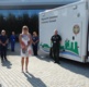 Converted ambulance with staff standing alongside