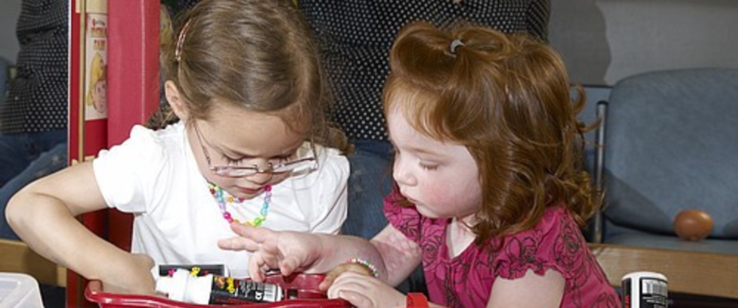 Two young girls playing together