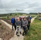 Image shows a group of men in a field