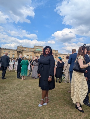 Image shows a woman standing 