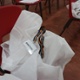 A lab coat left on a chair in a school hall
