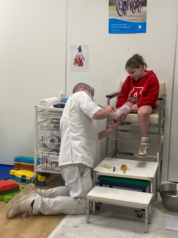 Alys being measured for her prosthetic leg