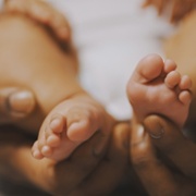 Hands and baby feet
