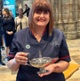 Nicola holding a lamp inside Westminster Abbey