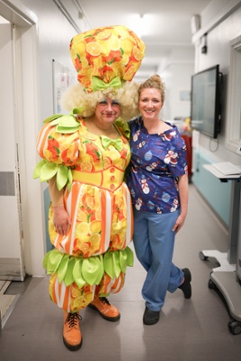 Kev in costume with staff from the Cancer Centre