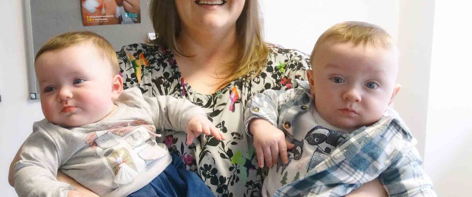 Mother Emma Rees pictured smiling with twins Sophie and Ollie