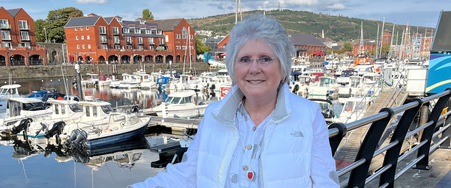 A woman stood next to a marina