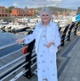 A woman stood next to a marina