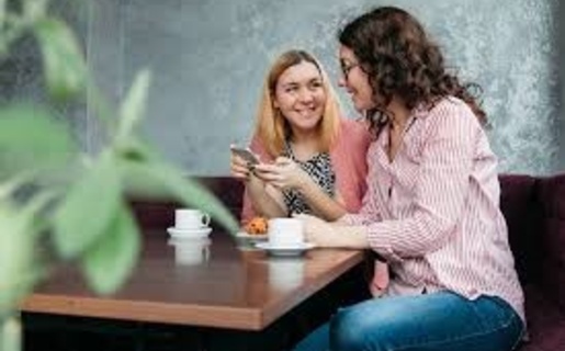 Two women talking over coffee