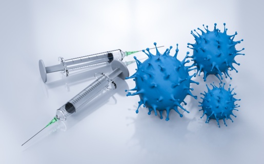 Two syringes on a table next to three blue COVID viruses.