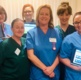 Nurses hold up their ipads