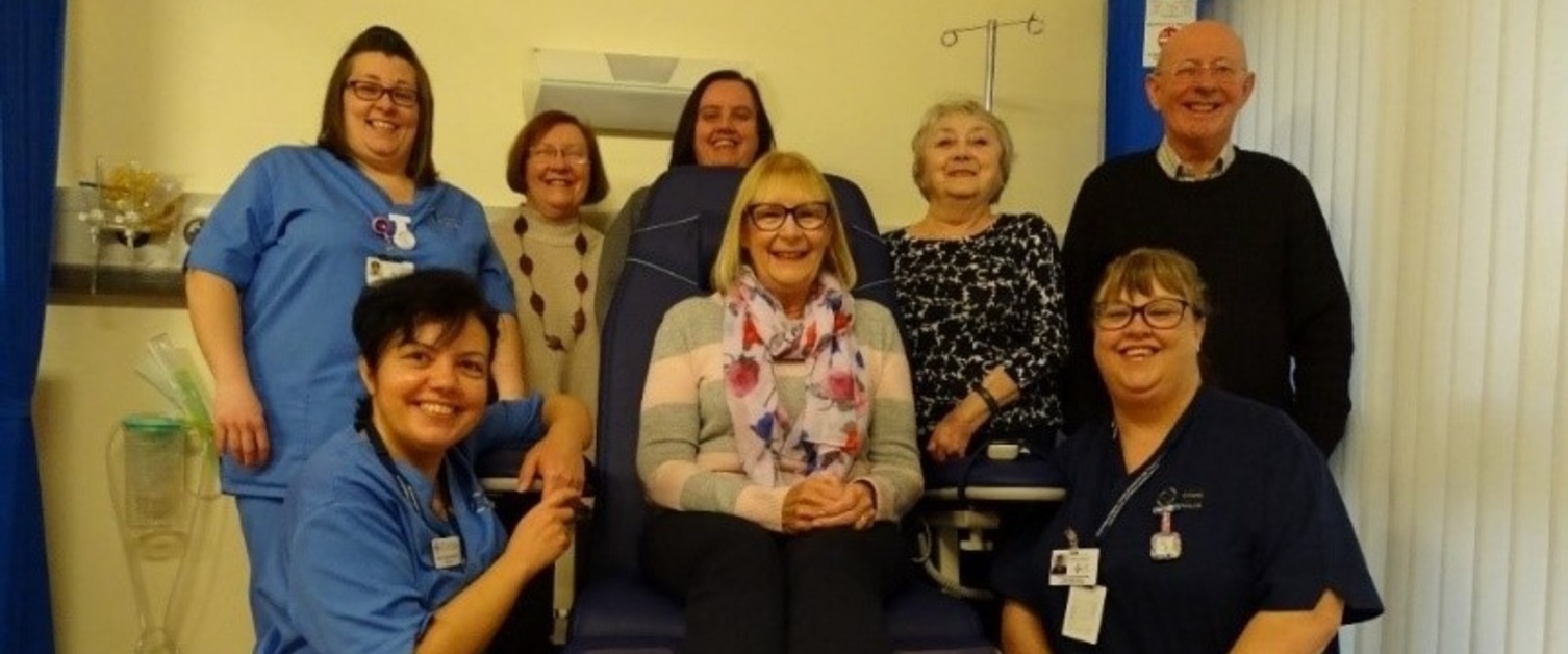 Members of Rheumatology staff and members of a group with a new rheumatology chair.