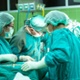 Surgeons operating on a patient 