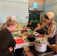 People taking part in a cookery demonstration