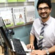 A picture of pharmacist Umar Hussain at his desk