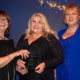 Lynne Hall stands with two other ladies as she holds her RCN award.