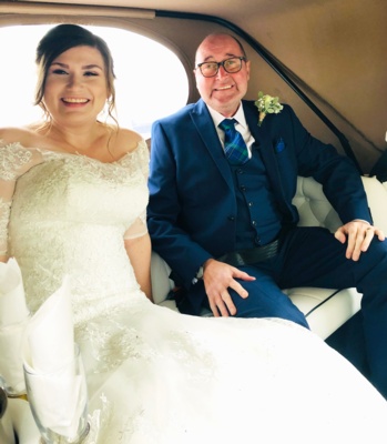 Bride and man in car