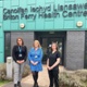 Three women stood outside a GP surgery