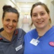 Image shows two midwives smiling into the camera.