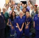 Image shows a group of hospital staff on a ward.