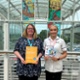 Debbie and Lucie holding leaflets for the sessions