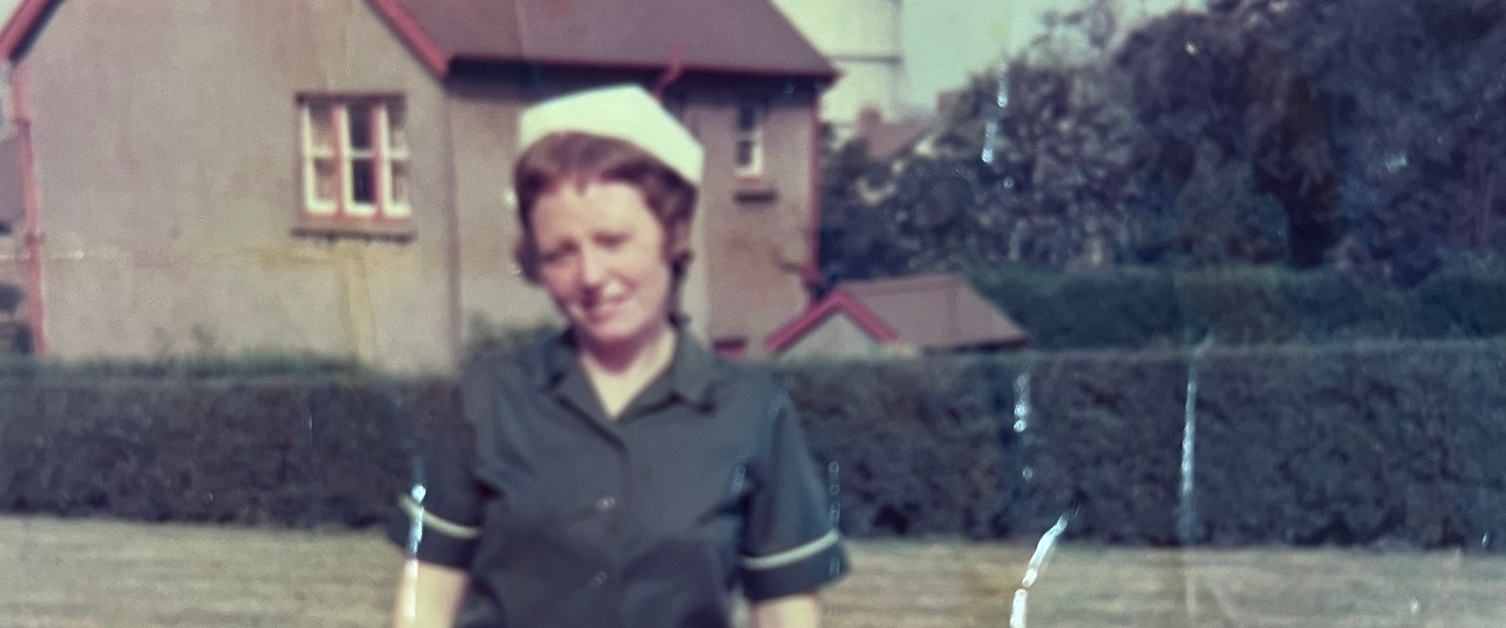 Image shows a woman in old nurse uniform