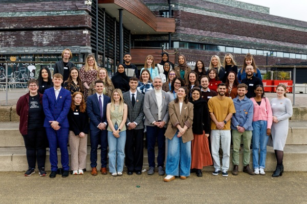 Image shows a group of people standing