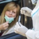 a woman in a car waiting to be tested