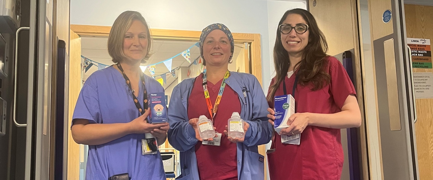 Image shows three women holding liquid paracetamol